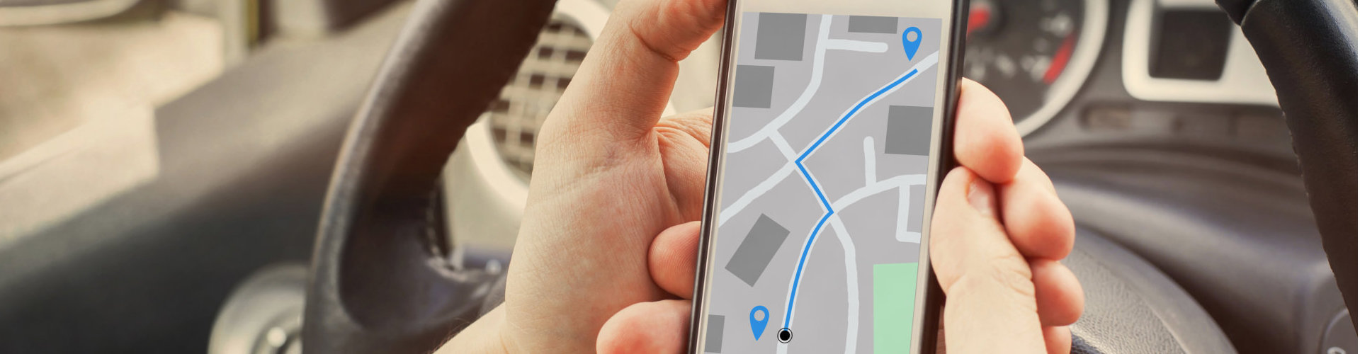 driver using direction navigation on GPS map on the screen of mobile smartphone in the car
